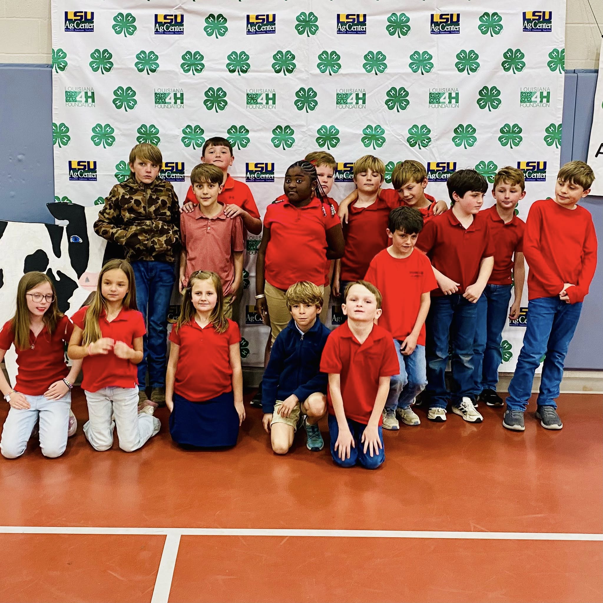 A group of kids posing for a photo.